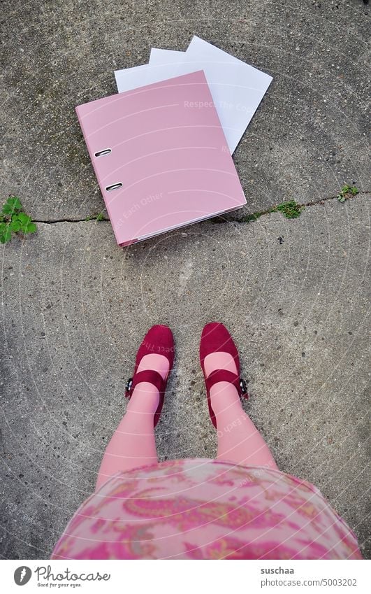 pink file folder with woman on the street File Piece of paper Arrangement Street Asphalt Stand Woman Pink Skirt Legs Stockings feet High heels feminine Strange