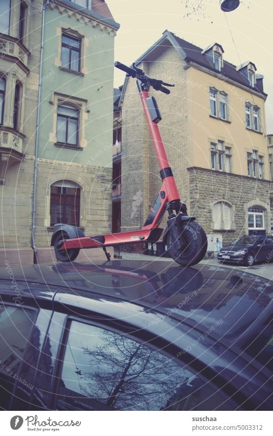 Park differently Town car e-roller Elketro vehicle Electric stream Parking unusual park switch off Vehicle Street Transport Mobility eMobility urban Modern