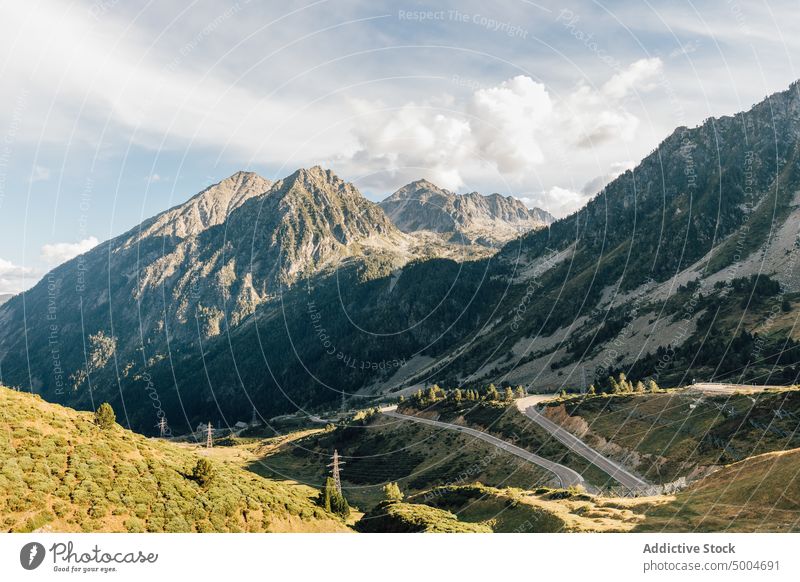 Road in mountains on sunny day road landscape ridge scenery rock highland roadway curve range pyrenees lleida catalonia spain spectacular cloudy nature rocky