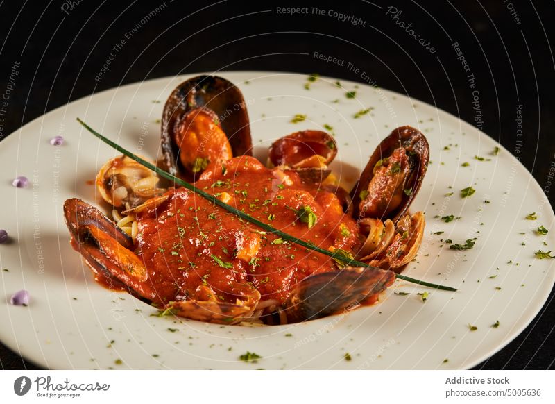Spaghetti ai frutti di mare on plate spaghetti ai frutti di mare seafood sauce tomato italian cuisine restaurant serve pasta dish mussel prawn clam calamari