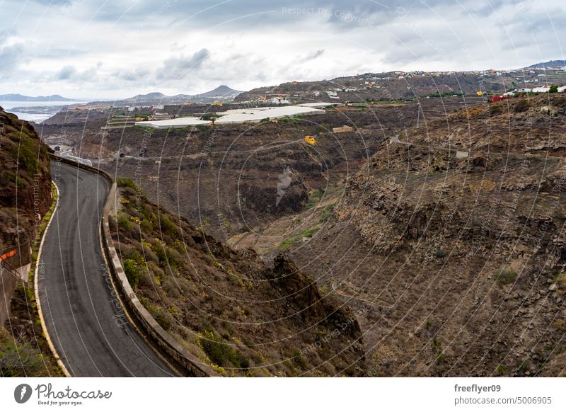 Classic Gran Canaria landscape with a road and a banana plantation gran canaria canary islands volcanic wilderness rock stone summer canyon las palmas
