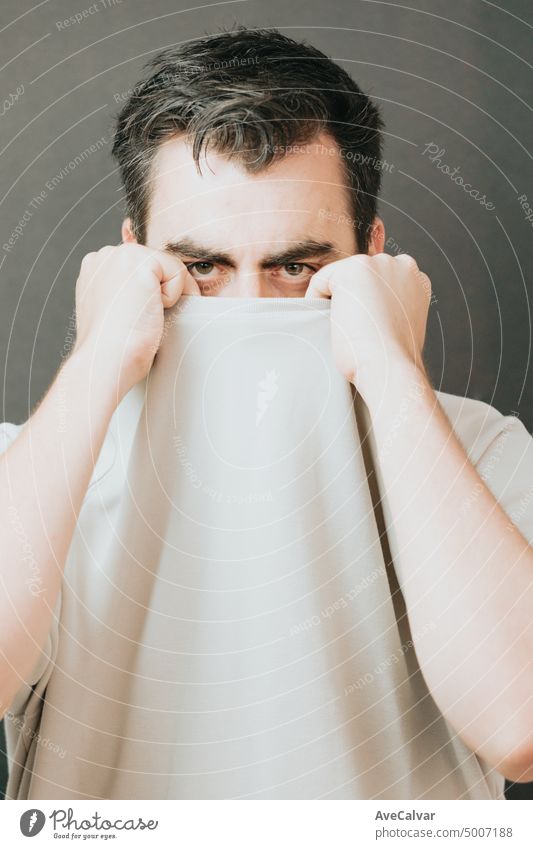 Close up portrait of healthy man with beard and black hair, strong features, looking straight.sad and depressed young man feeling upset. Human expressions and negative emotions.personality psychology.