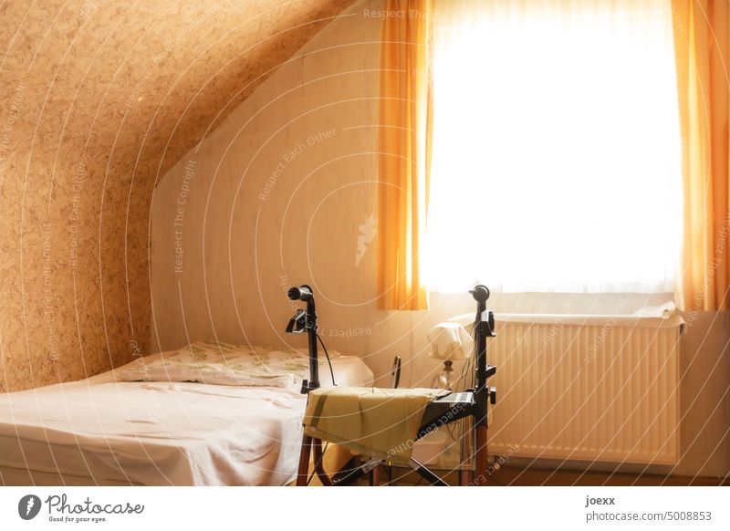 Rollator in a sparsely furnished bedroom by a bed Walking aid Mobility Loneliness Sleeping room Health care Colour photo Interior shot Window Empty Deserted