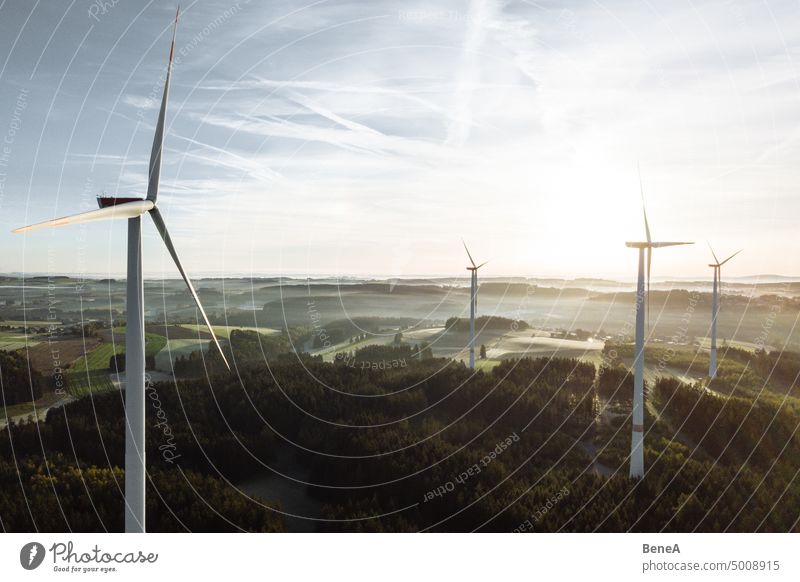 Wind turbine in the sunrise seen from an aerial view Aerial Clean Cleantech Converter Country Countryside Electrical Electricity Energy Forest Future Generation