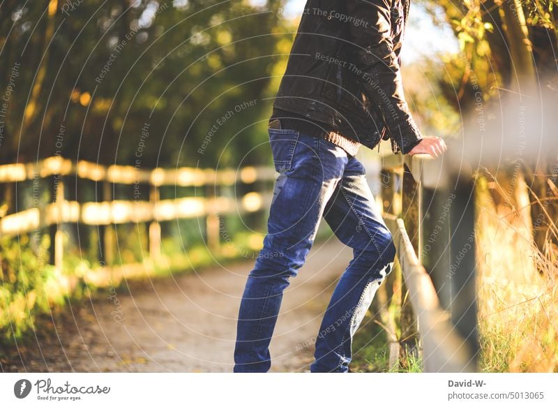 anonymous man standing in nature supported by railing Man Nature Observe tranquillity To enjoy silent Anonymous Cool Leather jacket Fashion Relaxation