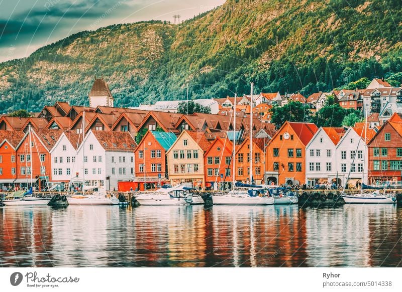 Bergen, Norway. View Of Historical Buildings Houses In Bryggen - Hanseatic Wharf In Bergen, Norway. UNESCO. yellow ship jetty lake destination scenic landmark