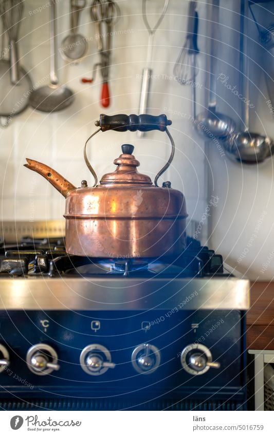 https://www.photocase.com/photos/5016759-gas-stove-with-kettle-stove-and-oven-kitchen-warmth-photocase-stock-photo-large.jpeg