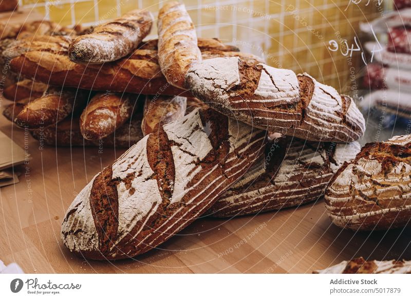 Fresh bread loaves on counter bakery artisan fresh baked loaf rustic crispy product pastry crust food tradition delicious cuisine natural meal kitchen whole