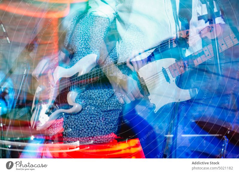 Bass player playing on stage concert instrument musical entertainment performer closeup live rock electric guitar performance musician guitarist band blues solo