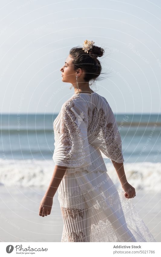 Bride in elegant dress on sandy sea shore bride white dress woman style feminine wedding celebrate seashore festive coast hair accessory romantic ornament lace