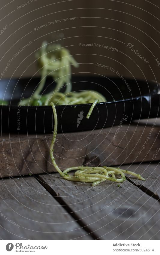 Tasty spaghetti with pesto sauce, spinach and parmesan cheese food spaguetti nutrition vitamin vegetarian eat from above detox freshness natural nobody cooking