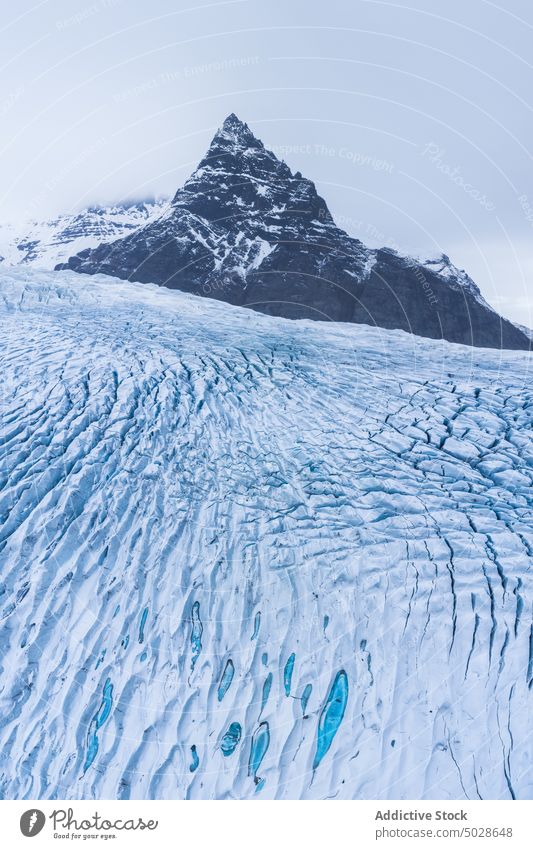 Snowy rocky mountains on winter day snow landscape scenery glacier range nature ridge fjallsarlon vatnajokull iceland breathtaking cloudy frozen highland