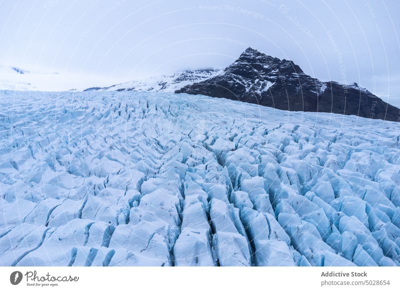 Snowy rocky mountains on winter day snow landscape scenery glacier range nature ridge fjallsarlon vatnajokull iceland breathtaking cloudy frozen highland