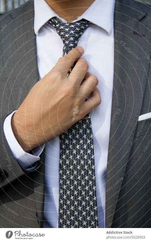 Crop businessman in elegant suit classy tie necktie formal entrepreneur gentleman well dressed jacket style male manager adjust respectable executive confident