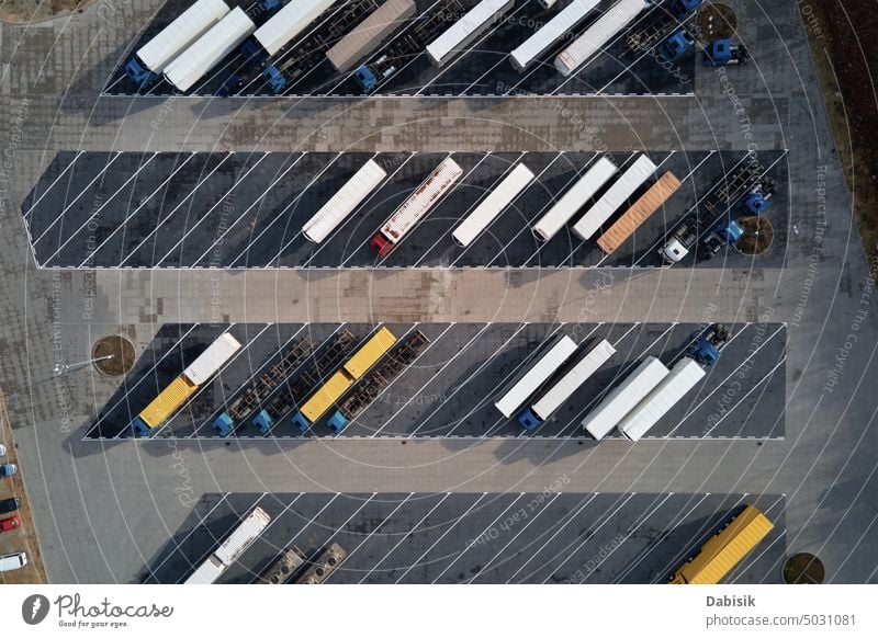 Top view of trucks on parking lot near logistic warehouse trailers transport top view cargo transportation delivery highway semi truck shipping load business