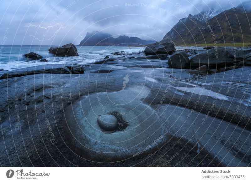 Lightning flashing above stormy sea on cloudy day mountain lightning thunderstorm landscape sky dramatic scenic ocean nature energy picturesque weather marine