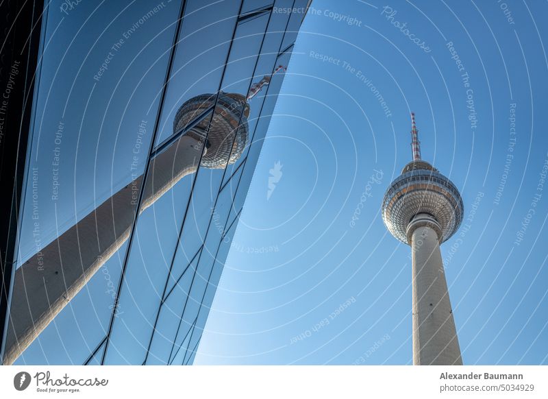 Television tower in Berlin, Germany - mirrored by a near building berlin germany fernsehturm landmark architecture tv alexanderplatz city television sky urban