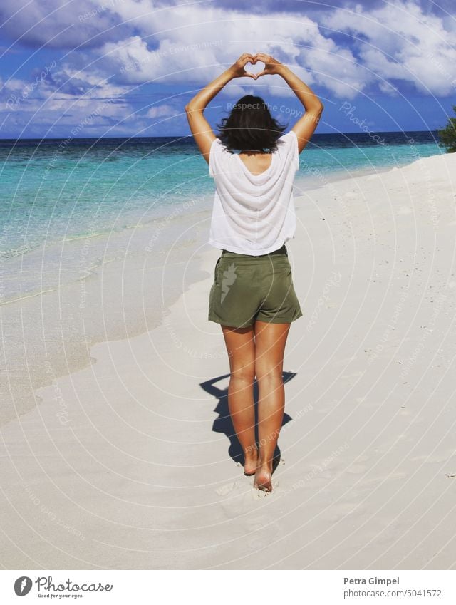 Woman on beach with heart symbol Beach Ocean Clouds Turquoise Water Sand Walk on the beach Sandy beach Summer vacation Vacation & Travel Sky Landscape Horizon