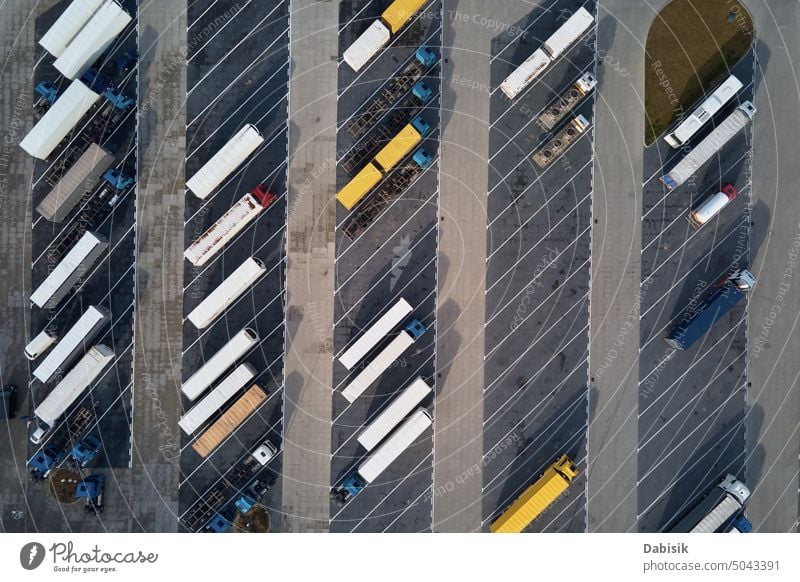 Top view of trucks on parking lot near logistic warehouse trailers transport top view cargo transportation delivery highway semi truck shipping load business