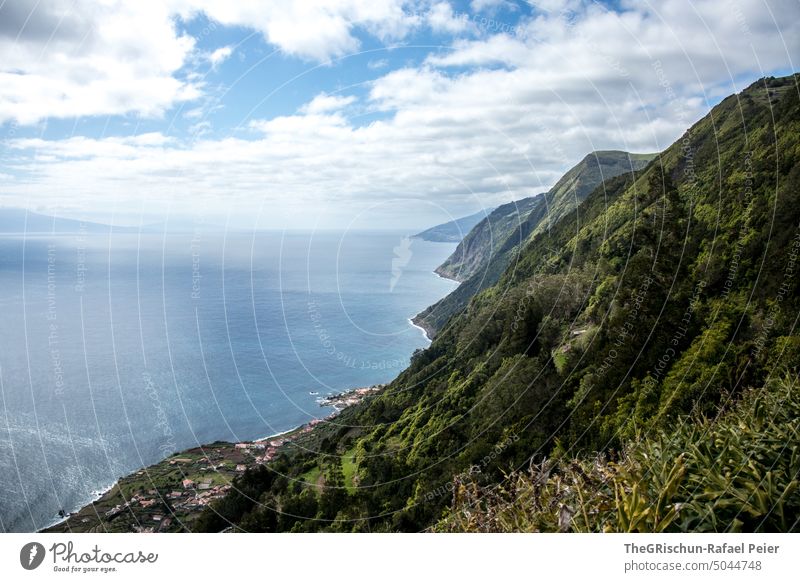 Coast with sea view Cliff Water Waves salt water Bad weather slope coast Ocean Exterior shot Landscape Villages Blue sky Sky Rock Vacation & Travel Azores