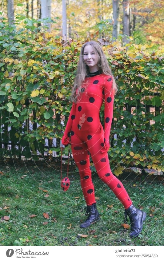 Fall fashion 2022  superheroine in skintight catsuit anime cosplay  carnival ladybug  a Royalty Free Stock Photo from Photocase