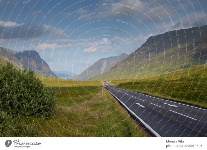 A82 road through Glencoe in the Scottish Highlands a82 highlands scotland mountain valley clouds cloudy green grass grass field nature Scotland Mountain