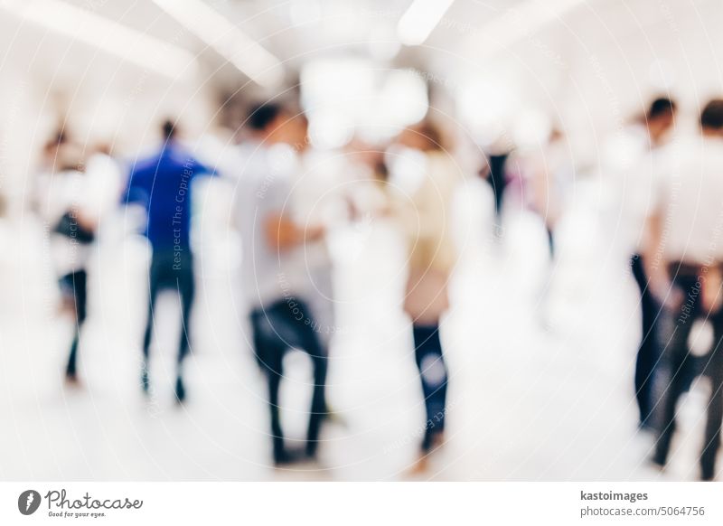 Abstract blurred people socializing during coffee break at business conference. event celebration socialize seminar men networking group press meeting party