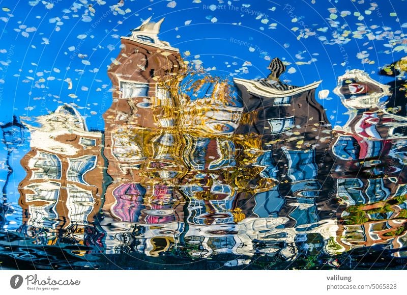 Colorful reflection of the buildings along the canal in Amsterdam in the autumn Dutch Europe Holland Netherlands architecture city color colorful