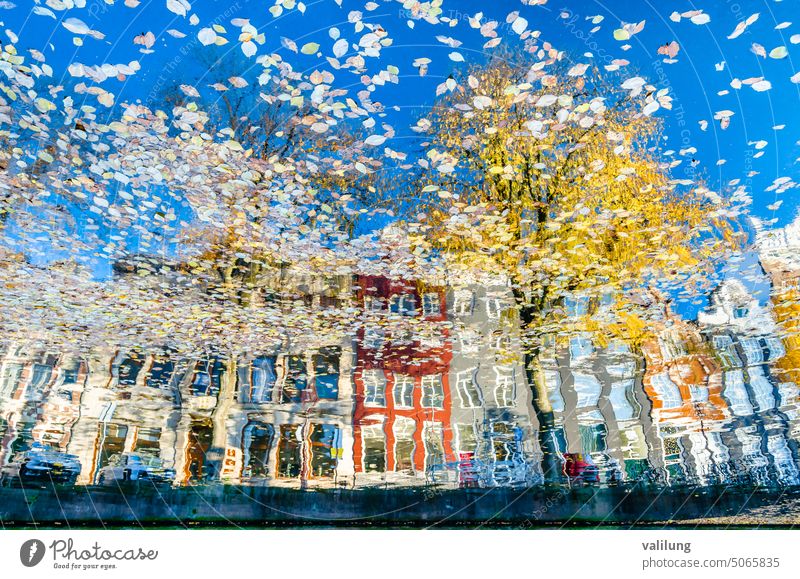 Colorful reflection of the buildings along the canal in Amsterdam in the autumn Dutch Europe Holland Netherlands architecture city color colorful