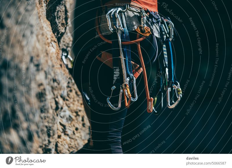 Rock climbers on a rock wall closeup. Climbing gear and equipment. Black  and white. Stock Photo