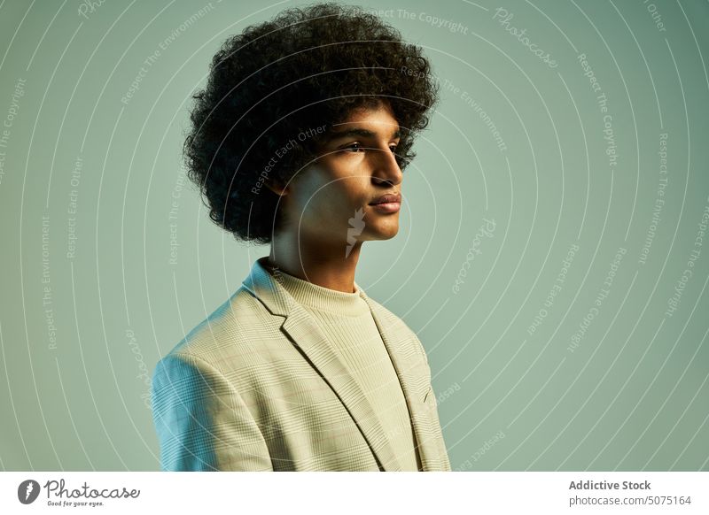 Stylish Hispanic man with Afro hairstyle suit afro model independent modern outfit character individuality male young hispanic ethnic smart casual curly hair