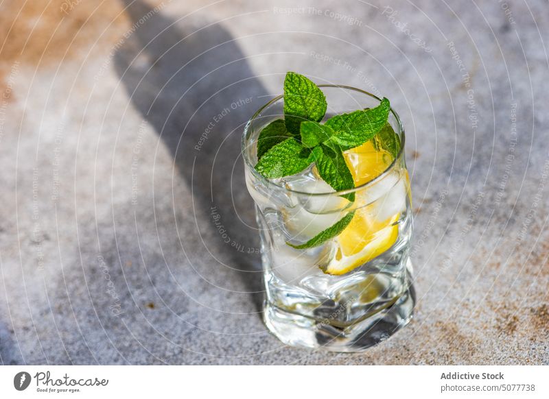 Glass of lemon water with mint background beverage cocktail day diet dieting drink fresh glass healthy lemonade lifestyle organic refreshment ripe served shadow