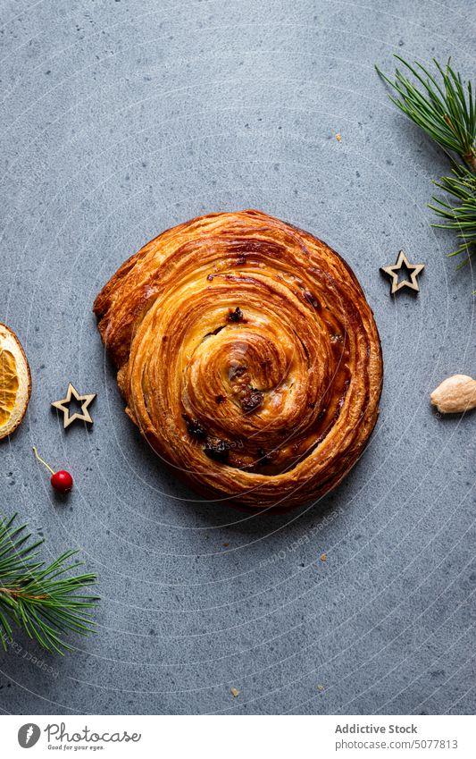 Delicious baked snail pastry with Christmas decoration food sweet roll christmas homemade pine tree tradition arrangement cuisine table dessert meal culinary