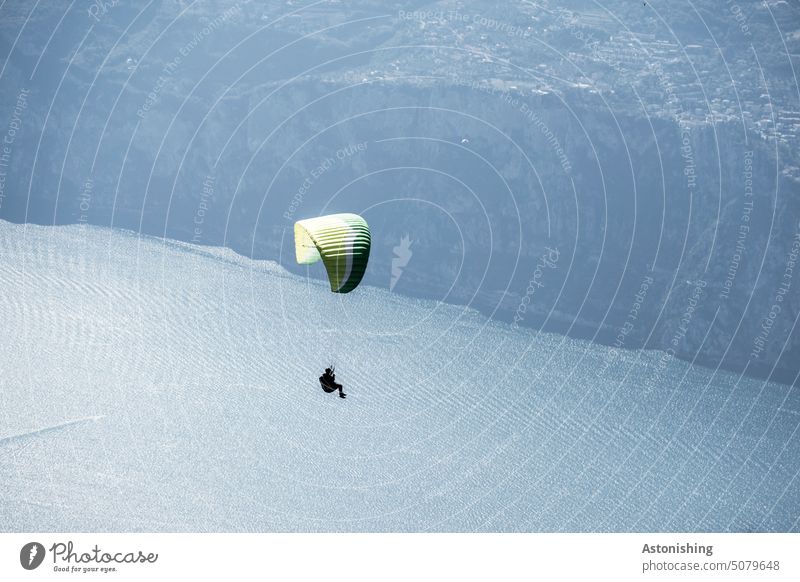 Paragliding in the mountains paraglider Paraglider Lake Garda monte baldo Shadow 2 Tall Above Hover Flying Dark Landscape up Sky cloud clear Summer String Cords