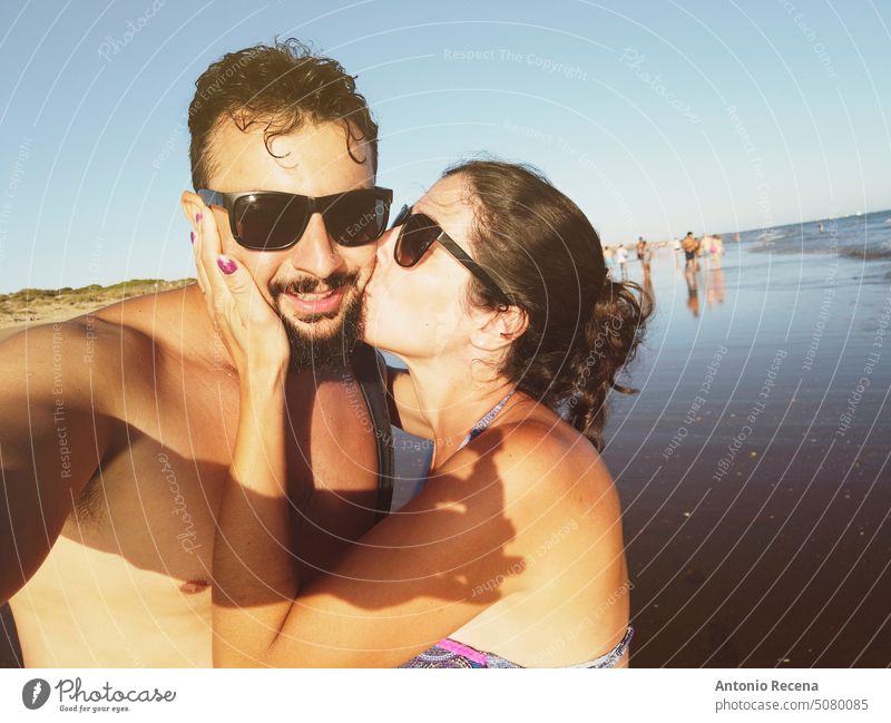 self portrait of mid adult couple in the beach selfie kiss huelva andalusia spain people person lifestyles posing smile happy outdoors holidays hot summer