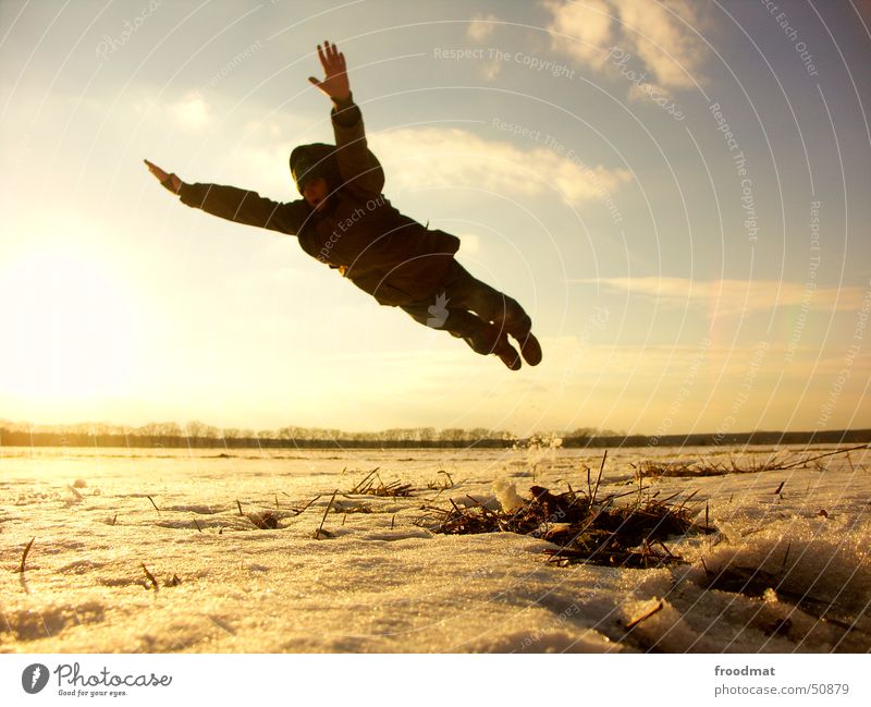 Jump in the deep end Superman Winter Cold Sunset Back-light Frozen Meadow Clouds Action Light heartedness Comic Elated Easygoing Freeze Outstretched Style