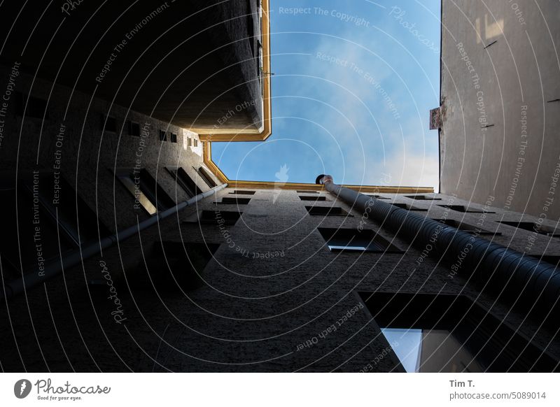 View of the sky in a backyard in the district of Wedding Courtyard Interior courtyard Backyard House (Residential Structure) Facade Window Town Deserted