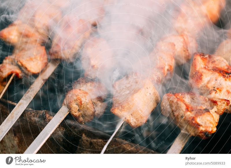 Grilled Barbecue Meat Shashlik Shish Kebab Pork Meat Grilling On Metal Skewer beef meal caucasus close cooking grill grilling red metal skewer coal picnic meat