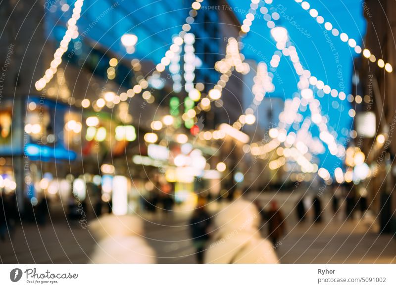 Helsinki, Finland. New Year Boke Lights Xmas Christmas Tree Decoration And Festive Illumination In Aleksanterinkatu Street. Defocused Blue Bokeh Background Effect. Design Backdrop