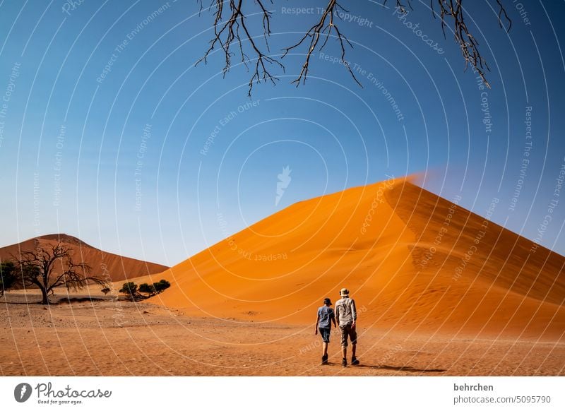 two in front of a mountain Adventure in common Family & Relations Infancy Child Together Father Son sand dune dunes duene Impressive especially Loneliness