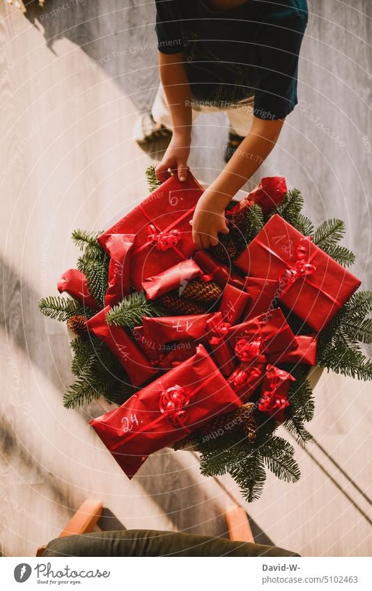 Child with gifts for advent advent season Christmas Joy Anticipation Surprise do-it-yourself Self-made christmas time