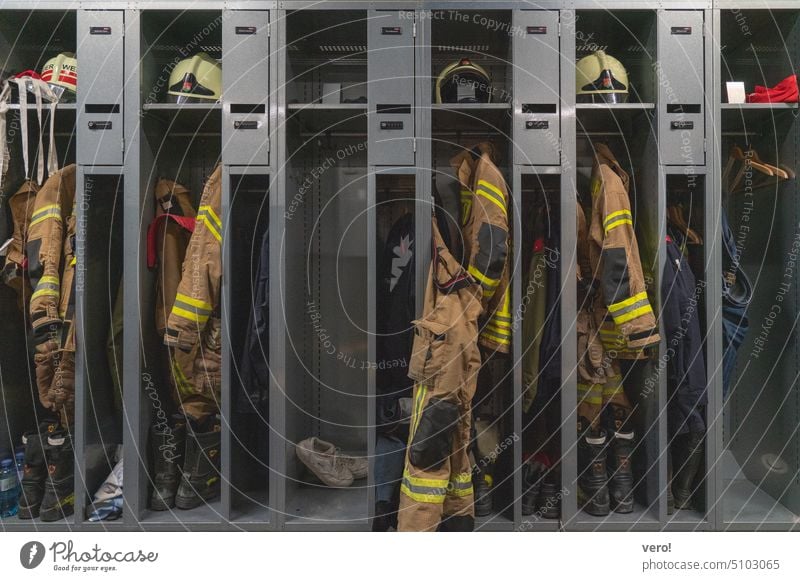 Fire department operational clothing in open boxes Interior shot Colour photo firefighter jacket Yellow Coat Jacket Protective clothing Workwear Clothing