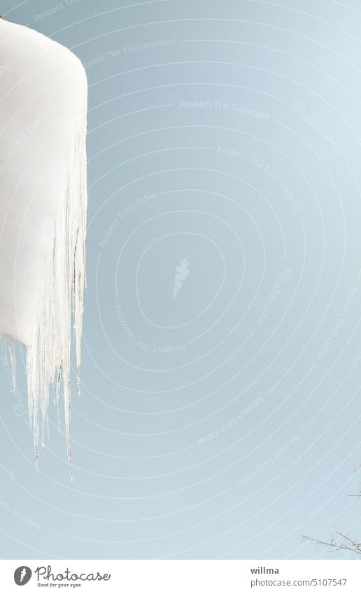 Frozen snow and icicles hanging from the roof - ozapft is! Icicle Snow Cold Winter winter Copy Space Neutral background Frost chill Ice