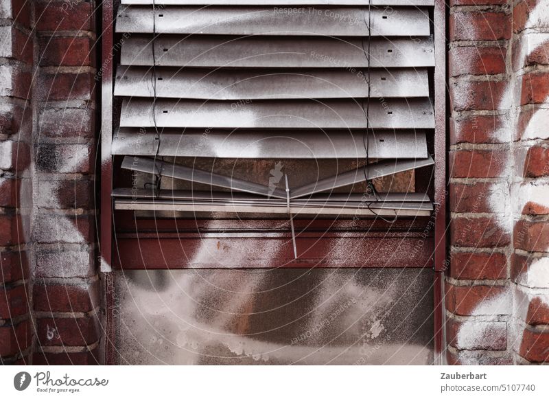 Blind in front of window on brick wall with graffiti is held together with cable ties Venetian blinds Window Wall (building) Graffiti Cable strap Improvise