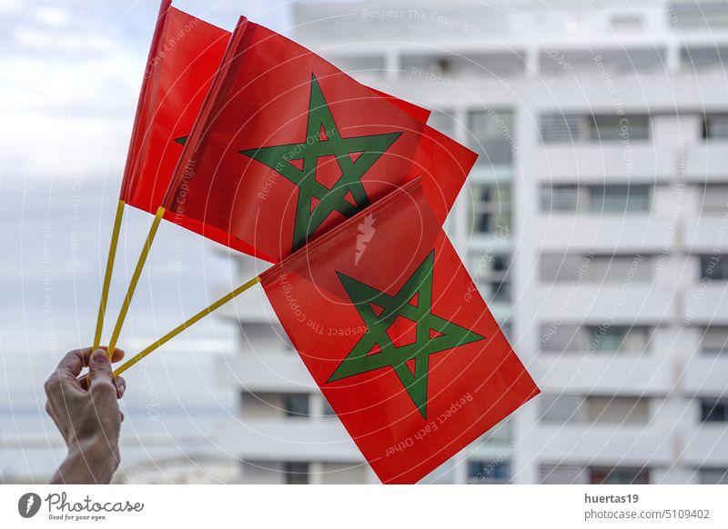 Hands with flags of Morocco with defocused background morocco hands symbol national moroccan white patriotism country team ensign morocco flag moroccan flag