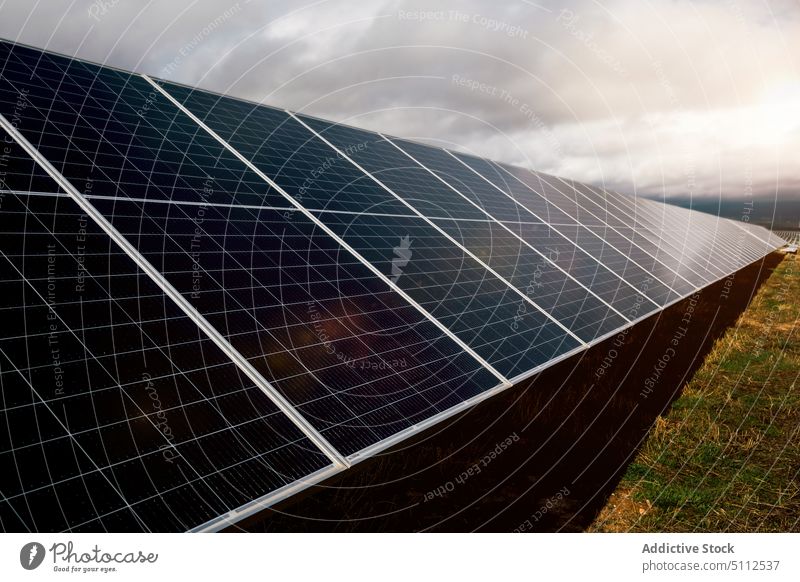 Solar panels on power station solar cloudy sky reflection shiny daytime energy electricity technology photovoltaic ecology renewable alternative industry