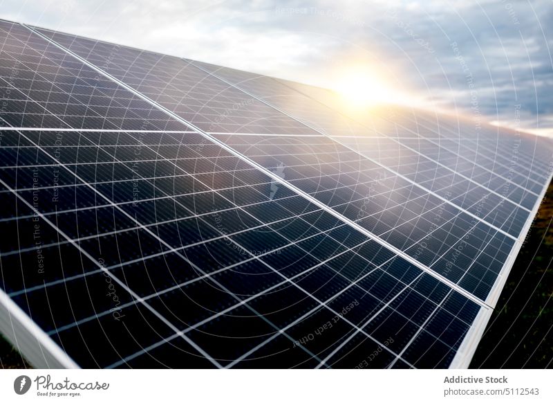 Solar panels on power station solar cloudy sky reflection shiny daytime energy electricity technology photovoltaic ecology renewable alternative industry