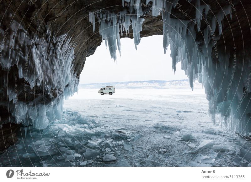 UAZ terrain minibus (box bread) on the ice of Lake Baikal, photographed from an ice cave icily Siberia tin loaf Russia Siberian winter Off-road minibus