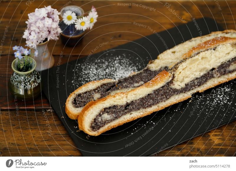 Man does not live on gingerbread alone | he also needs poppy seed stollen Cake Tunnel poppy seed snail Food photograph food Food Photography food and drink