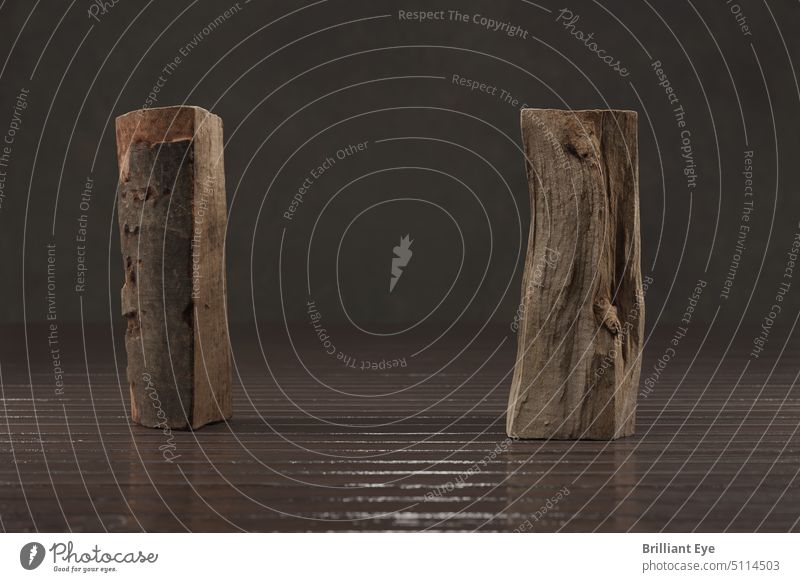 two standing firewood pieces on old planks decorative split section brown detail energy warm front view fossil fuel studio shot close-up cut fireplace winter